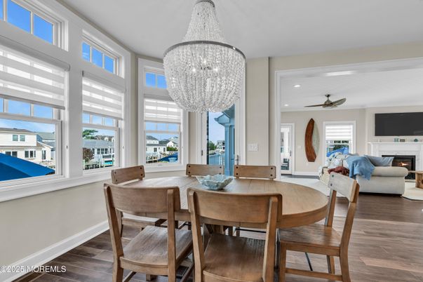 Chandelier, Dining room, Fireplace, Interior, Living room, Recessed Lighting, Wood Texture Flooring