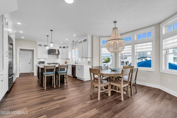 Chandelier, Dining room, Interior, Kitchen, Pendant Lights, Recessed Lighting, Stainless Steel Appliances, Wood Texture Flooring