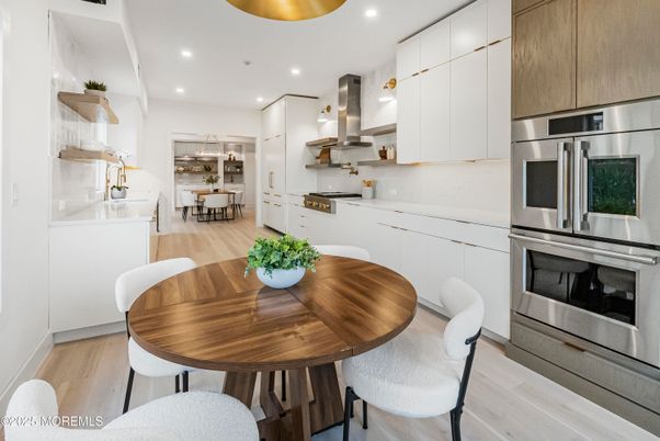 Dining room, Interior, Kitchen, Recessed Lighting, Stainless Steel Appliances, Wood Texture Flooring