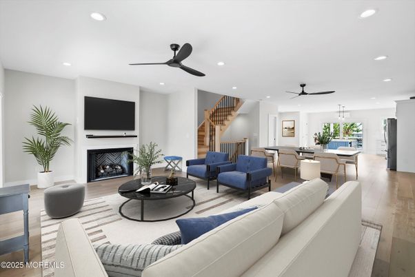Dining room, Fireplace, Interior, Living room, Recessed Lighting, Wood Texture Flooring