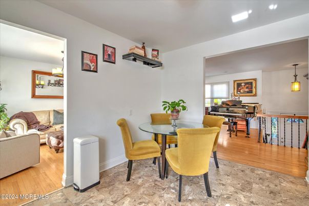 Dining room, Interior, Living room, Pendant Lights, Piano, Recessed Lighting, Wood Texture Flooring