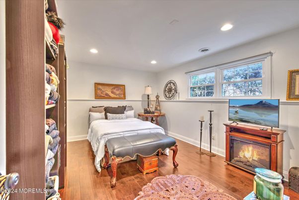 Bedroom, Fireplace, Interior, Recessed Lighting, Wood Texture Flooring