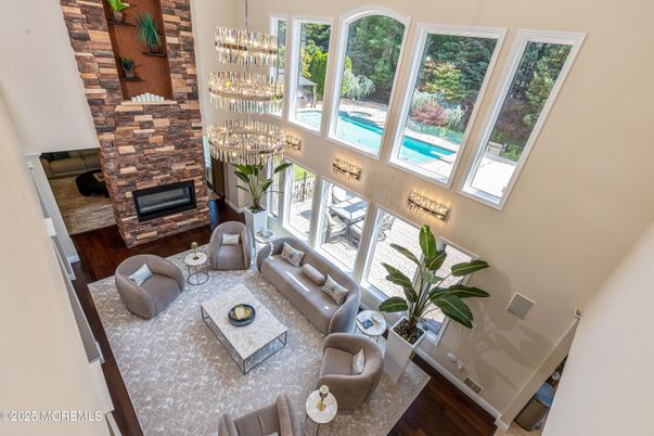 Chandelier, Dining room, Fireplace, Interior, Living room, Stone Walls, Wood Texture Flooring