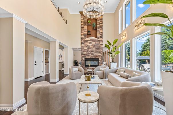 Chandelier, Fireplace, Interior, Living room, Recessed Lighting, Wood Texture Flooring