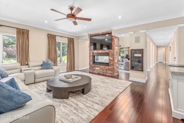 Fireplace, Interior, Living room, Recessed Lighting, Stone Walls, Wood Texture Flooring