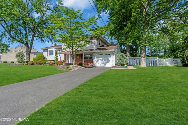 Attached, Backyard, Exterior, Facade, Brick Facade, Cape Cod