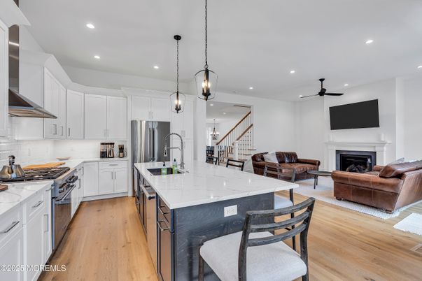 Fireplace, Interior, Kitchen, Living room, Pendant Lights, Recessed Lighting, Stainless Steel Appliances, Wood Texture Flooring