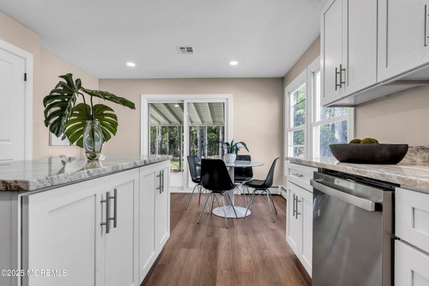Dining room, Interior, Kitchen, Recessed Lighting, Stainless Steel Appliances, Wood Texture Flooring