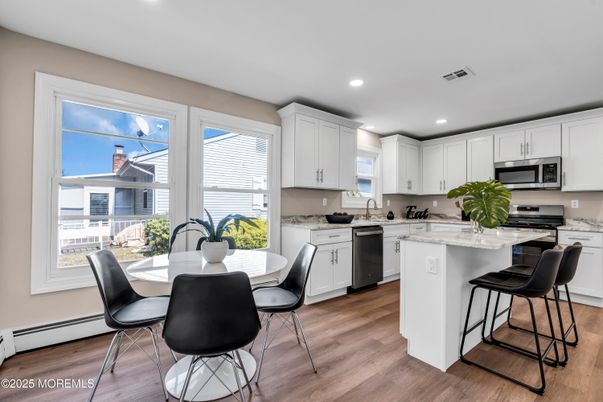 Dining room, Interior, Kitchen, Recessed Lighting, Stainless Steel Appliances, Wood Texture Flooring