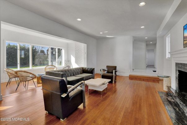 Dining room, Fireplace, Interior, Living room, Recessed Lighting, Wood Texture Flooring
