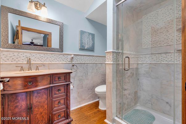 Bathroom, Glass Shower, Interior, Marble Walls, Wood Texture Flooring