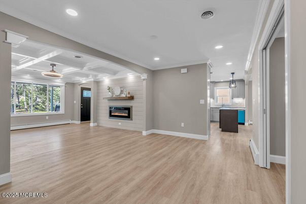 Empty room, Fireplace, Interior, Kitchen, Pendant Lights, Recessed Lighting, Wood Texture Flooring