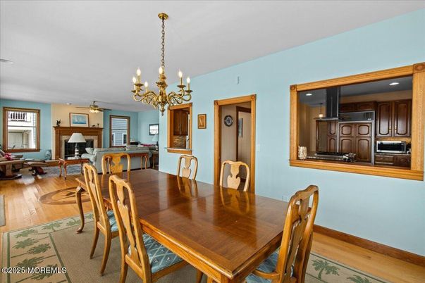 Chandelier, Dining room, Fireplace, Interior, Kitchen, Living room, Wood Texture Flooring
