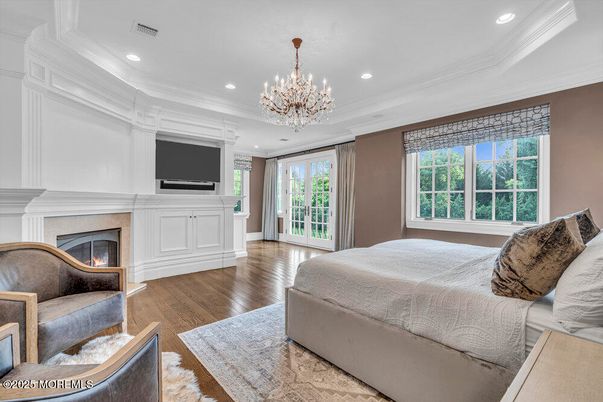 Bedroom, Chandelier, Fireplace, Interior, Recessed Lighting, Wood Texture Flooring