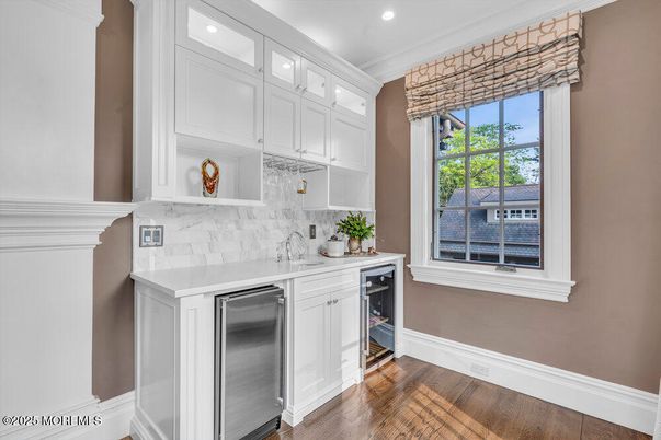 Interior, Kitchen, Marble Walls, Recessed Lighting, Stainless Steel Appliances, Wood Texture Flooring