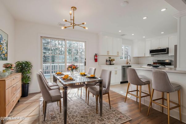 Dining room, Interior, Kitchen, Pendant Lights, Recessed Lighting, Stainless Steel Appliances, Wood Texture Flooring
