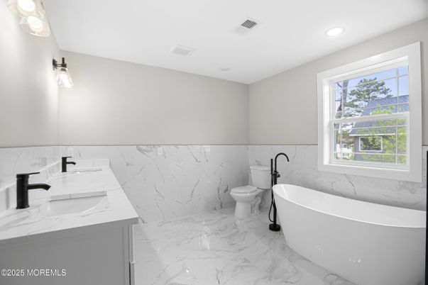 Bathroom, Dual Sink Vanities, Free Standing Baths, Interior, Marble, Marble Walls, Recessed Lighting