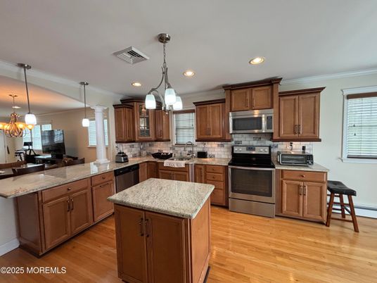 Chandelier, Interior, Kitchen, Pendant Lights, Recessed Lighting, Stainless Steel Appliances, Wood Texture Flooring