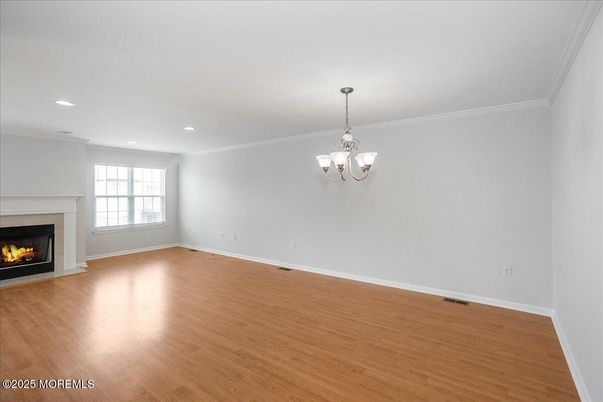 Chandelier, Empty room, Fireplace, Interior, Recessed Lighting, Wood Texture Flooring