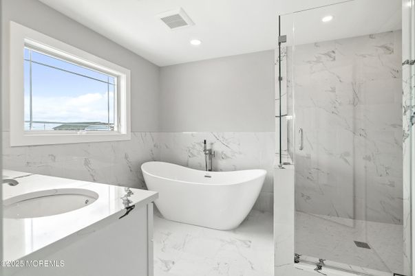 Bathroom, Free Standing Baths, Glass Shower, Interior, Marble, Marble Walls, Recessed Lighting