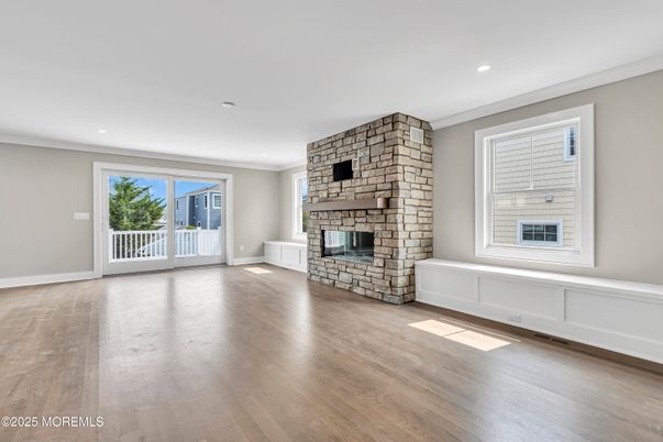 Empty room, Fireplace, Interior, Recessed Lighting, Stone Walls, Wood Texture Flooring