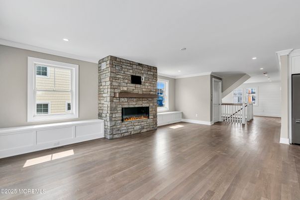 Empty room, Fireplace, Interior, Recessed Lighting, Stone Walls, Wood Texture Flooring