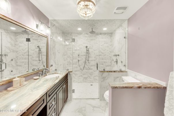 Bathroom, Chandelier, Dual Sink Vanities, Glass Shower, Interior, Marble, Marble Walls, Recessed Lighting
