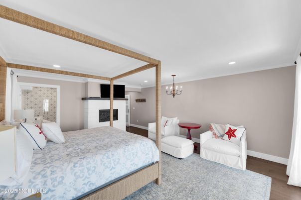 Bedroom, Chandelier, Fireplace, Interior, Recessed Lighting, Wood Texture Flooring