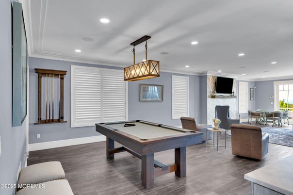 Billiard Table, Dining room, Fireplace, Game Room, Interior, Living room, Pendant Lights, Recessed Lighting, Wood Texture Flooring