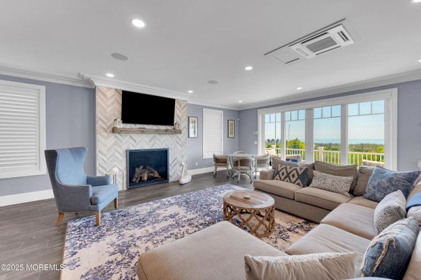 Dining room, Fireplace, Interior, Living room, Recessed Lighting, Water, Wood Texture Flooring