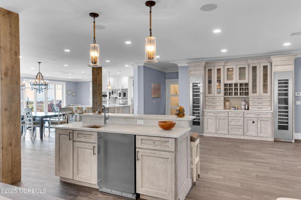 Chandelier, Dining room, Interior, Kitchen, Pendant Lights, Recessed Lighting, Stainless Steel Appliances, Wood Texture Flooring