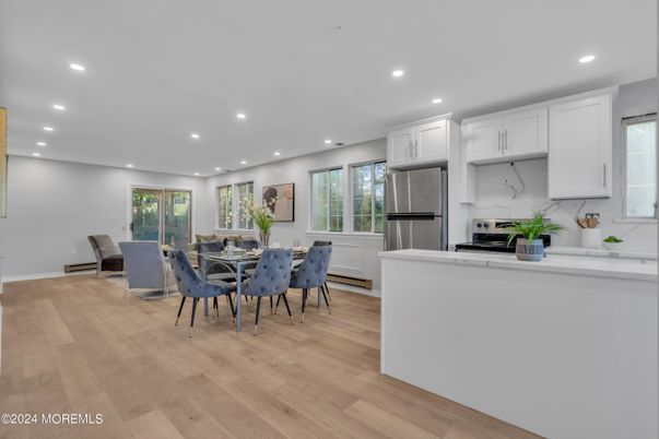 Dining room, Interior, Kitchen, Recessed Lighting, Stainless Steel Appliances, Wood Texture Flooring
