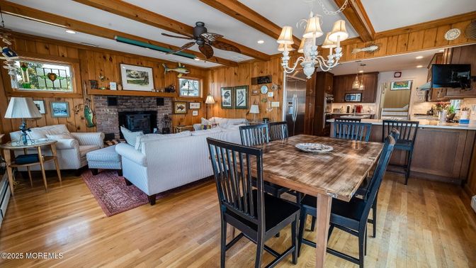Chandelier, Dining room, Fireplace, Interior, Kitchen, Living room, Recessed Lighting, Stone Walls, Wooden Beams, Wood Texture Flooring, Wooden Walls