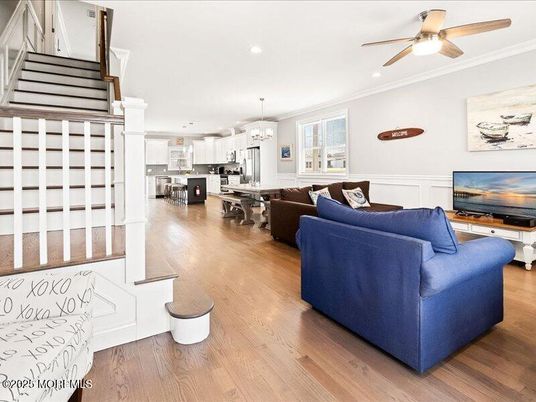 Chandelier, Dining room, Interior, Kitchen, Living room, Pendant Lights, Recessed Lighting, Stainless Steel Appliances, Wood Texture Flooring