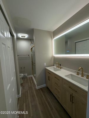 Bathroom, Dual Sink Vanities, Glass Shower, Interior, Wood Texture Flooring