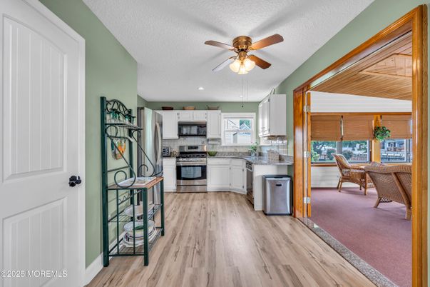 Dining room, Interior, Kitchen, Recessed Lighting, Stainless Steel Appliances, Wood Texture Flooring