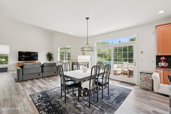 Dining room, Fireplace, Interior, Living room, Pendant Lights, Recessed Lighting, Wood Texture Flooring