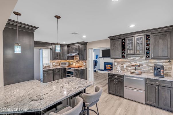 Interior, Kitchen, Pendant Lights, Recessed Lighting, Stainless Steel Appliances, Stone Walls, Wood Texture Flooring