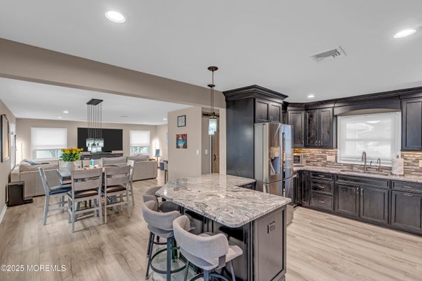 Dining room, Interior, Kitchen, Pendant Lights, Recessed Lighting, Stainless Steel Appliances, Wood Texture Flooring