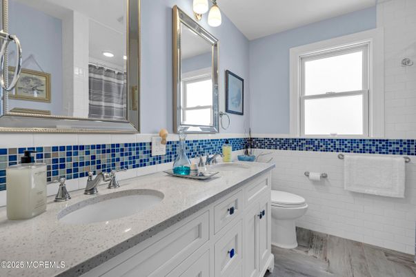 Bathroom, Dual Sink Vanities, Interior, Recessed Lighting, Wood Texture Flooring