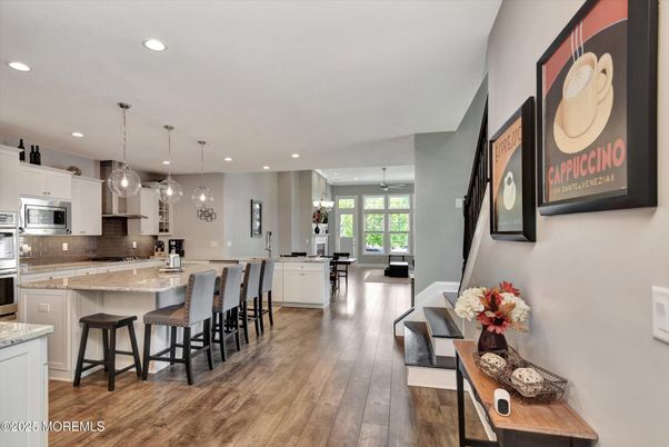 Dining room, Interior, Kitchen, Pendant Lights, Recessed Lighting, Stainless Steel Appliances, Wood Texture Flooring