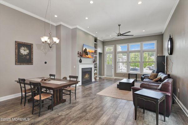 Chandelier, Dining room, Fireplace, Interior, Living room, Recessed Lighting, Wood Texture Flooring
