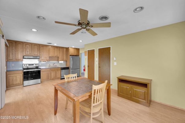 Dining room, Interior, Kitchen, Recessed Lighting, Stainless Steel Appliances, Wood Texture Flooring