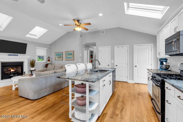 Fireplace, Interior, Kitchen, Living room, Recessed Lighting, Wood Texture Flooring