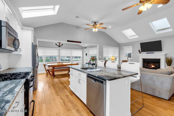 Dining room, Fireplace, Interior, Kitchen, Living room, Recessed Lighting, Wood Texture Flooring