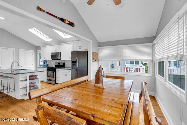 Dining room, Interior, Kitchen, Recessed Lighting, Stainless Steel Appliances, Wood Texture Flooring
