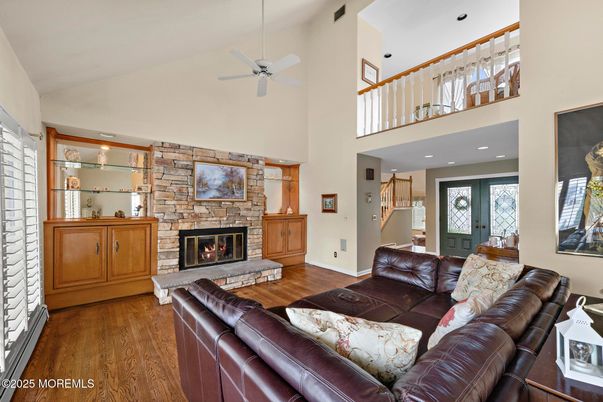 Fireplace, Interior, Living room, Recessed Lighting, Stone Walls, Wood Texture Flooring