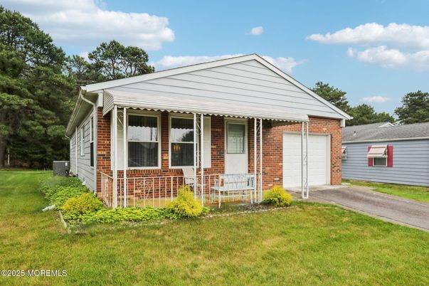 Attached, Backyard, Exterior, Facade, Brick Facade, Ranch