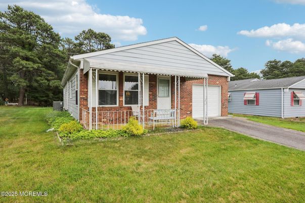 Attached, Backyard, Exterior, Facade, Brick Facade, Ranch