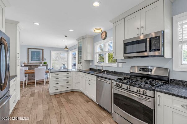 Dining room, Interior, Kitchen, Pendant Lights, Recessed Lighting, Stainless Steel Appliances, Wood Texture Flooring